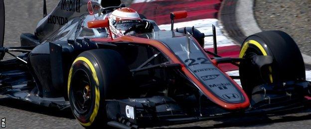 Jenson Button was in a late scrape with Pastor Maldonado but managed to bring his McLaren home