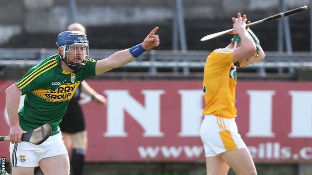 John Egan celebrates after hitting Kerry's winning point as Antrim's Odhran McFadden shows his dejection