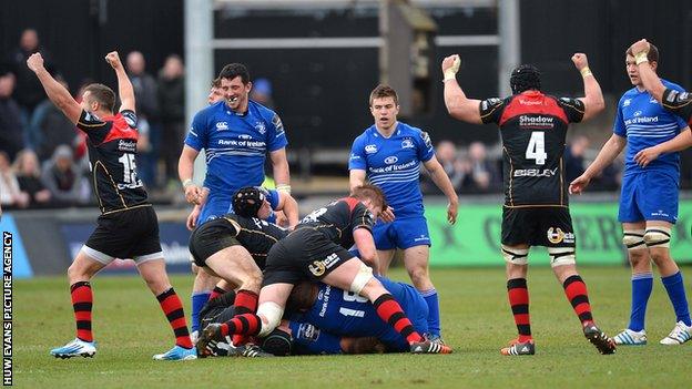 Dragons players celebrate a thrilling Pro12 win over Leinster at Rodney Parade