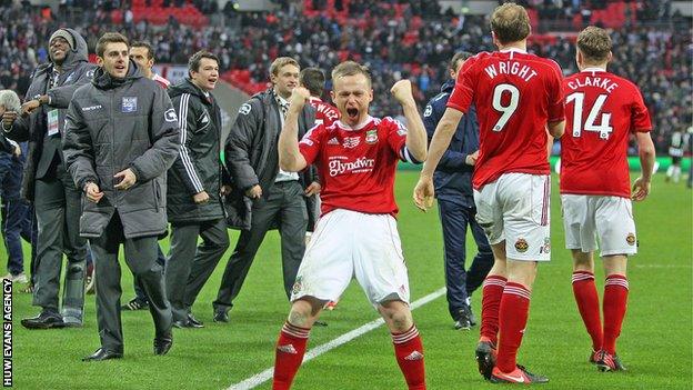 Dean Keates celebrates after leading Wrexham to victory in the FA Trophy final this season