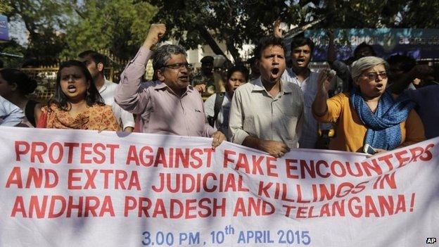 Activists shout slogans during a protest against two separate incidents of police killings on Tuesday in southern India, in New Delhi, India, Friday, April 10, 2015.