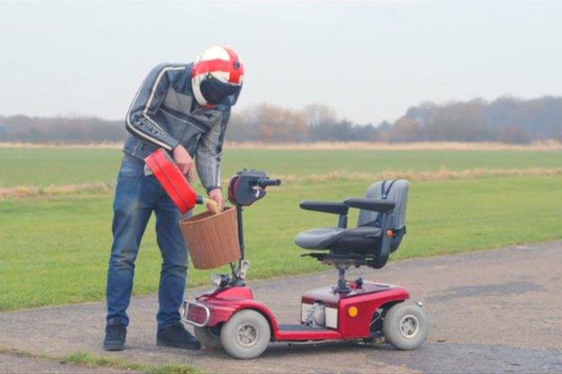 Colin Furze filling mobility scooter