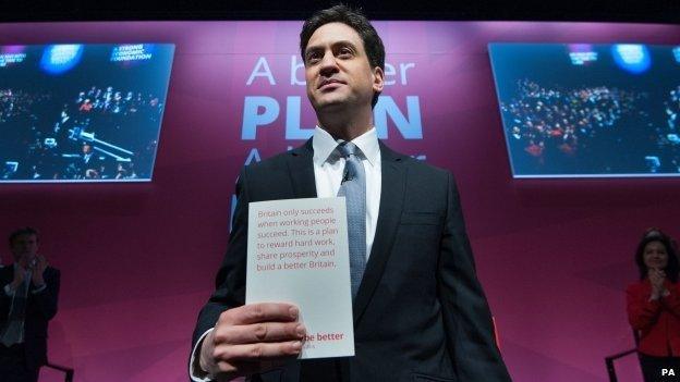 Ed Miliband holding the Labour manifesto