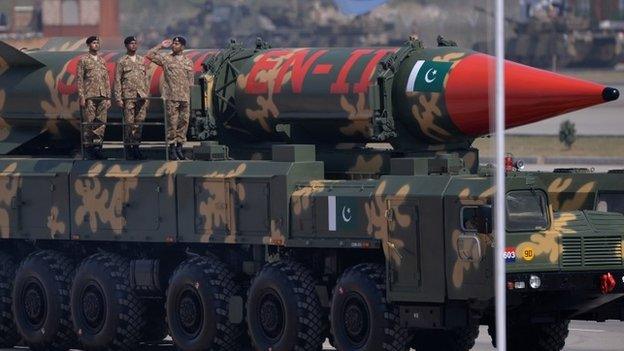 Pakistani military personnel stand beside long-range ballistic Shaheen II missiles during the Pakistan Day military parade in Islamabad on March 23