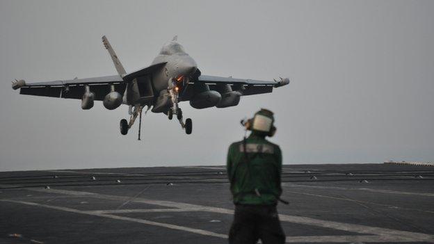 F/A-18F fighter landing on USS Carl Vinson