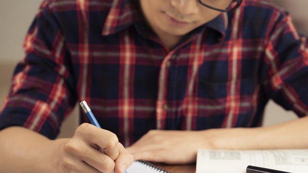 Boy taking exam