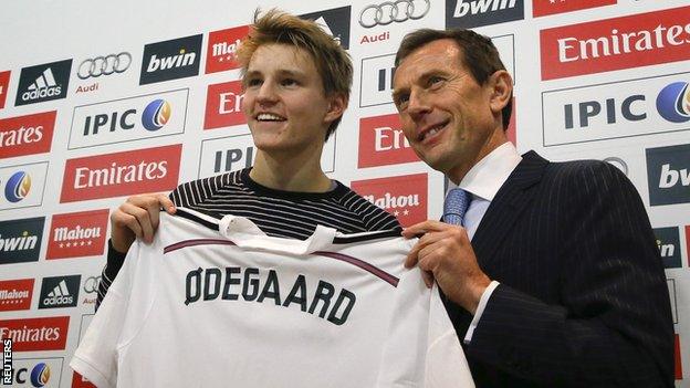 Martin Odegaard with Real Madrid institutional relations director Emilio Butragueno