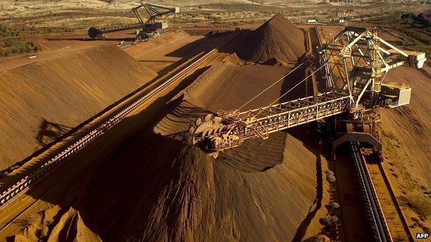 An undated handout photo released on September 4, 2009 by Rio Tinto shows a reclaimer working in the Yandicoogina stockyard and loading a conveyor with high grade iron ore in Western Australia's Pilbara region.