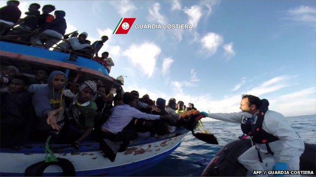 Italian Guardia Costiera takes part in a rescue operation of migrants off the coast of Sicily on 13 April 2015.