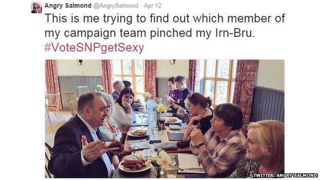 An image of Alex Salmond sharing a meal with voters is satirised with the phrase "This is me trying to find out which member of my campaign team pinched my Irn-Bru."