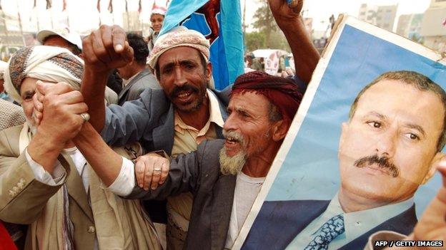 Yemeni protesters hold a portrait of Yemen"s former president Ali Abdullah Saleh during a demonstration against airstrikes carried out by the Saudi-led Arab coalition against Huthi militia in the capital Sanaa on 3 April 2015