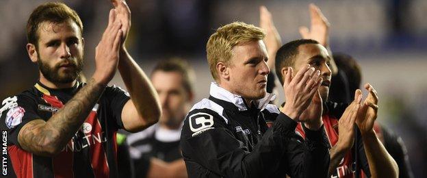 Eddie Howe (centre) and players applaud Bournemouth fans