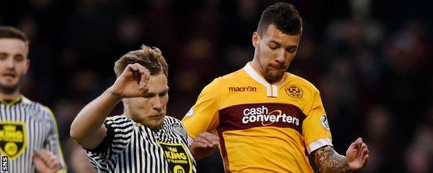 St Mirren's Marc McAusland challenges Motherwell's Marvin Johnson