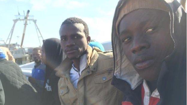 Two migrants on a boat