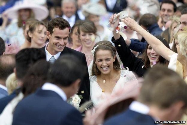 British tennis player Andy Murray and his new wife Kim Sears smile as they are showered in confetti after being married at Dunblane Cathedral