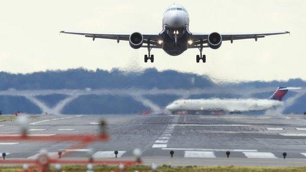 A US Airways Airbus A320 airplane takes off from a runway at Ronald Reagan Washington National Airport in Arlington, Virginia