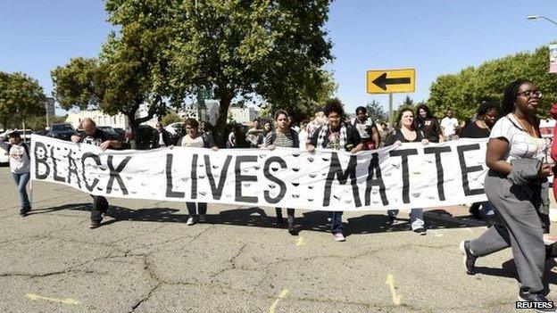 About fifty demonstrators march to protest police violence against minorities in Oakland April 14, 2015.