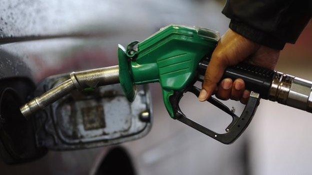 Driver filling car with petrol