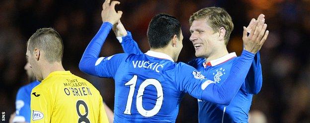 Haris Vuckic and Marius Zaliukas celebrate Rangers' equaliser