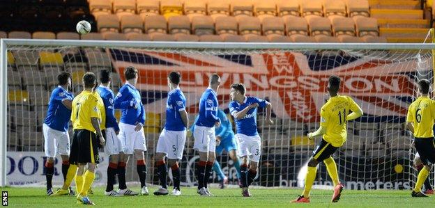 Myles Hippolyte curls his free-kick into the net