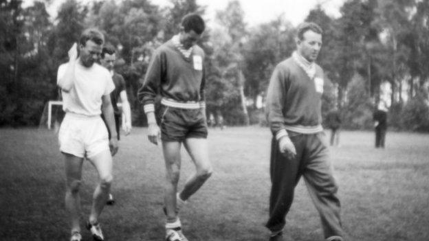 Future manager of Northern Ireland Billy Bingham, left, Peter McParland, in the background, Derek Dougan, centre, and Norman Uprichard (far right) during training in Sweden