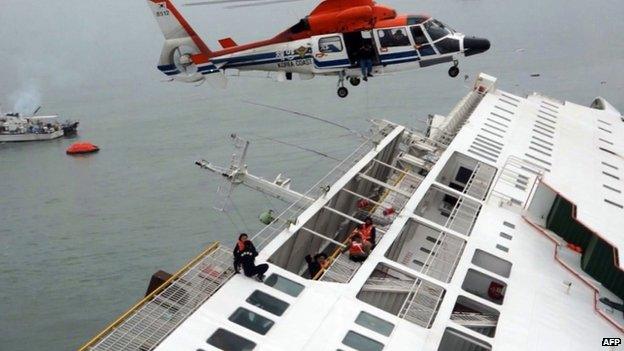 In this image taken from video released by News Y via Yonhap, passengers from a ferry sinking off South Korea's southern coast, are rescued by a South Korean Coast Guard helicopter in the water off the southern coast near Jindo, south of Seoul, Wednesday, 16 April 2014