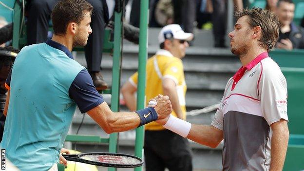 Grigor Dimitrov (left) greets Stan Wawrinka after his victory