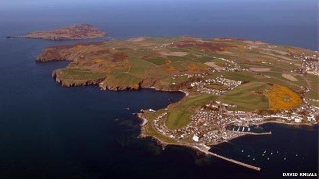 An aerial photograph looking towards the Calf of Man, over Port St Mary