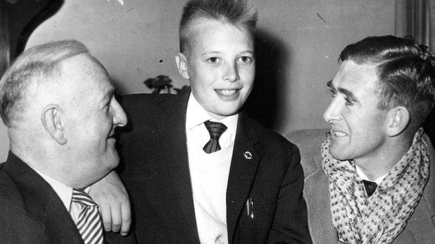 Bengt Jonasson, centre, who was Northern Ireland's adopted mascot at the 1958 World Cup, with trainer Gerry Morgan, left and captain Danny Blanchflower