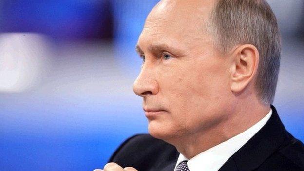 Russian President Vladimir Putin listens to a question during his annual televised phone-in with the nation in central Moscow on April 16, 2015