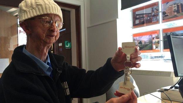 Alan Barnes with the key to his new home