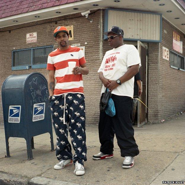 Photo of two men by mailbox