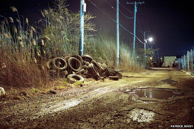 scrapyard by night