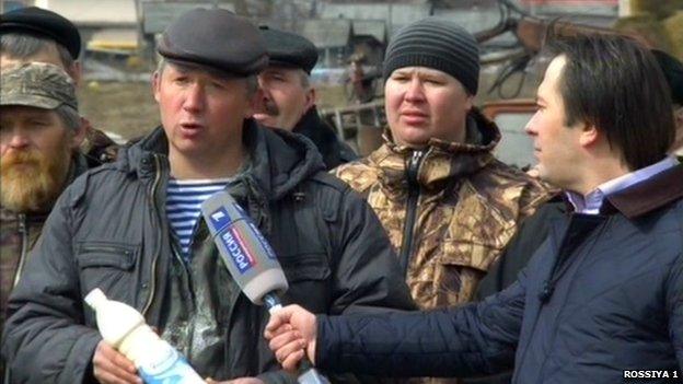 Screengrab from Russian TV showing milk farmers being interviewed for the phone-in programme