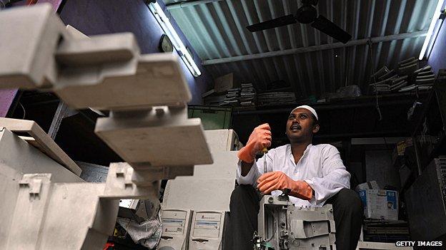 Man in India is dismantling discarded printers and hard drives