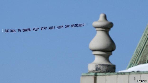 An aerial banner, sponsored by Doctor Without Borders opposing the Trans-Pacific Partnership Agreement (TPP) with the US government, is displayed by an airplane flying up the Hudson River in New York January 28, 2015.