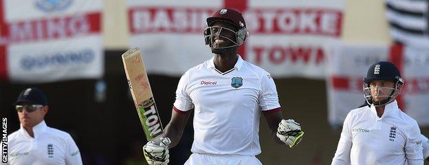 Jason Holder celebrates his century