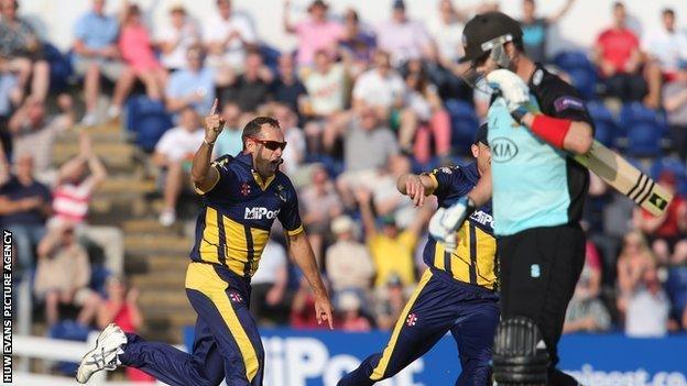 Dean Cosker celebrates after taking the wicket of Kevin Pietersen in the 2014 season