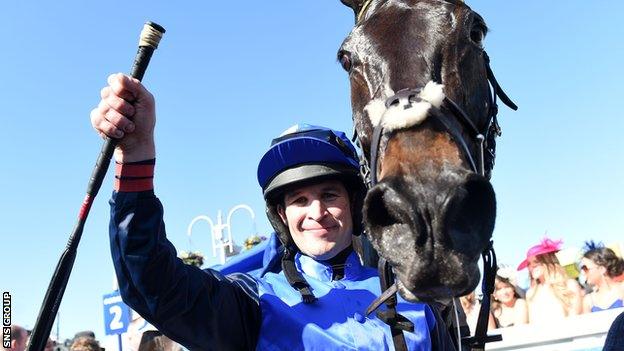 Jockey Robbie Dunne celebrates with winning horse Wayward Prince