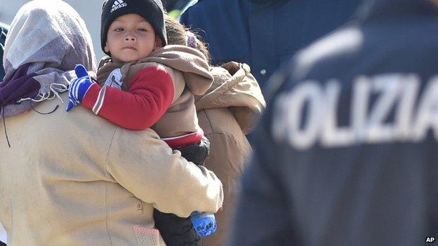Migrants arrive in the Sicilian port of Messina, 18 April