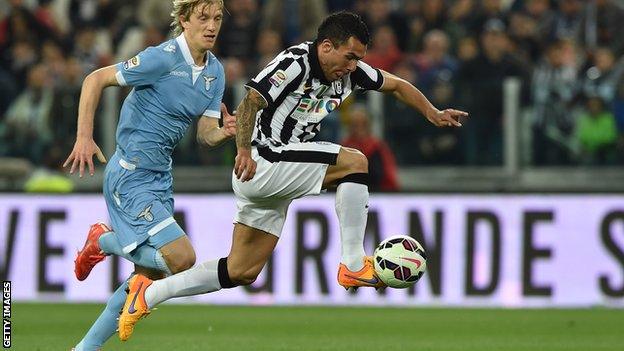 Juventus forward Carlos Tevez in action against Lazio