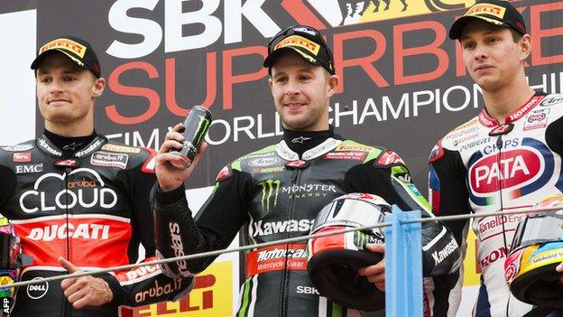 Chaz Davies, Jonathan Rea and Michael van der Mark celebrate on the podium