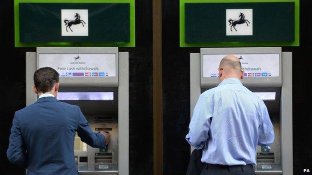 File photo dated 28/10/14 of members of the public using cash machines at a branch of Lloyds Bank in the City of London