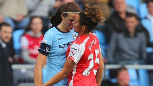 Manchester City midfielder Jill Scott head butts Arsenal's Jade Bailey.