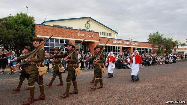 Members of the "9th Battalion AIF Living History Unit" march in Winton, Australia.