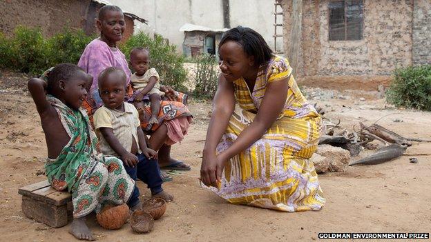 Phyllis Omodi talking to children