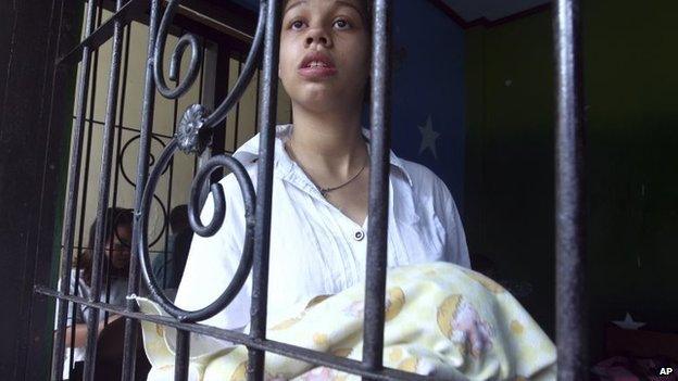 Heather Mack holds her baby daughter inside a cell before her trial at Denpasar District Court in Bali, Indonesia, on 7 April 2015.