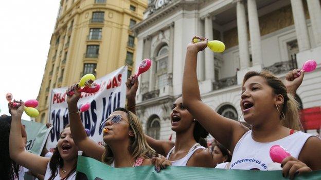 Women take part in a demonstration in defence of Brazil's President Dilma Rousseff and the state-run oil company Petrobras, in Rio de Janeiro 13 March 2015