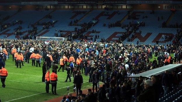 Fans on the Villa Park pitch after Aston Villa's FA Cup quarter-final win over West Brom