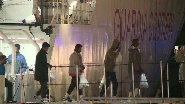 Migrants disembarking in Catania